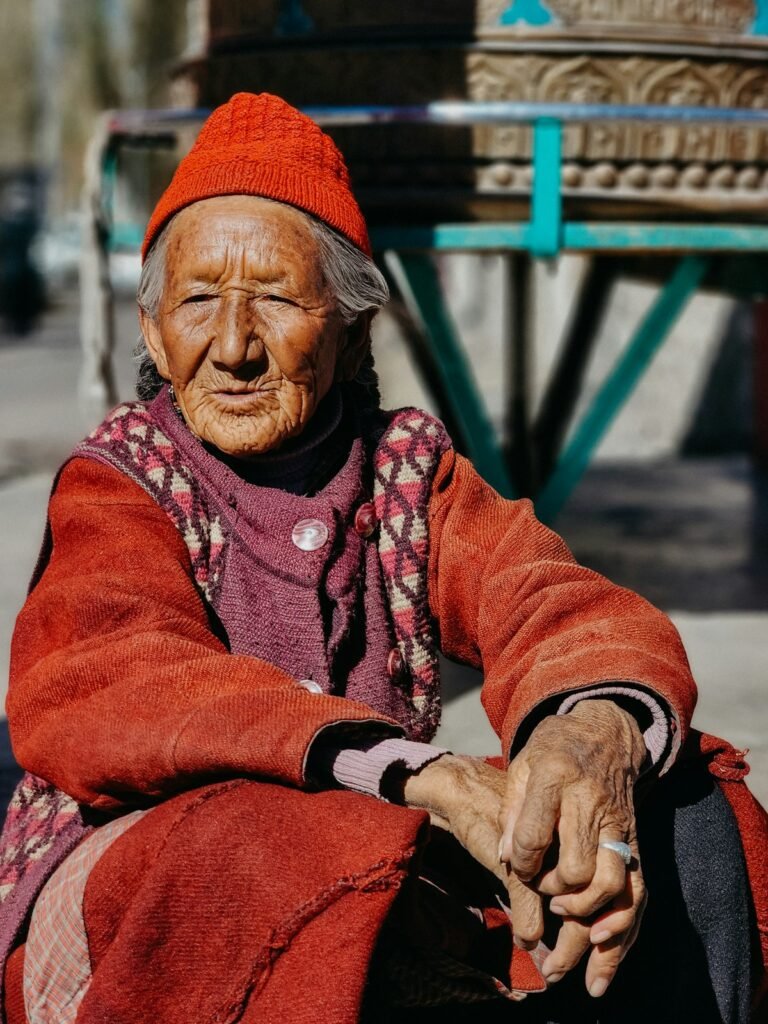 An elderly man in a red head scarf in Ladakh