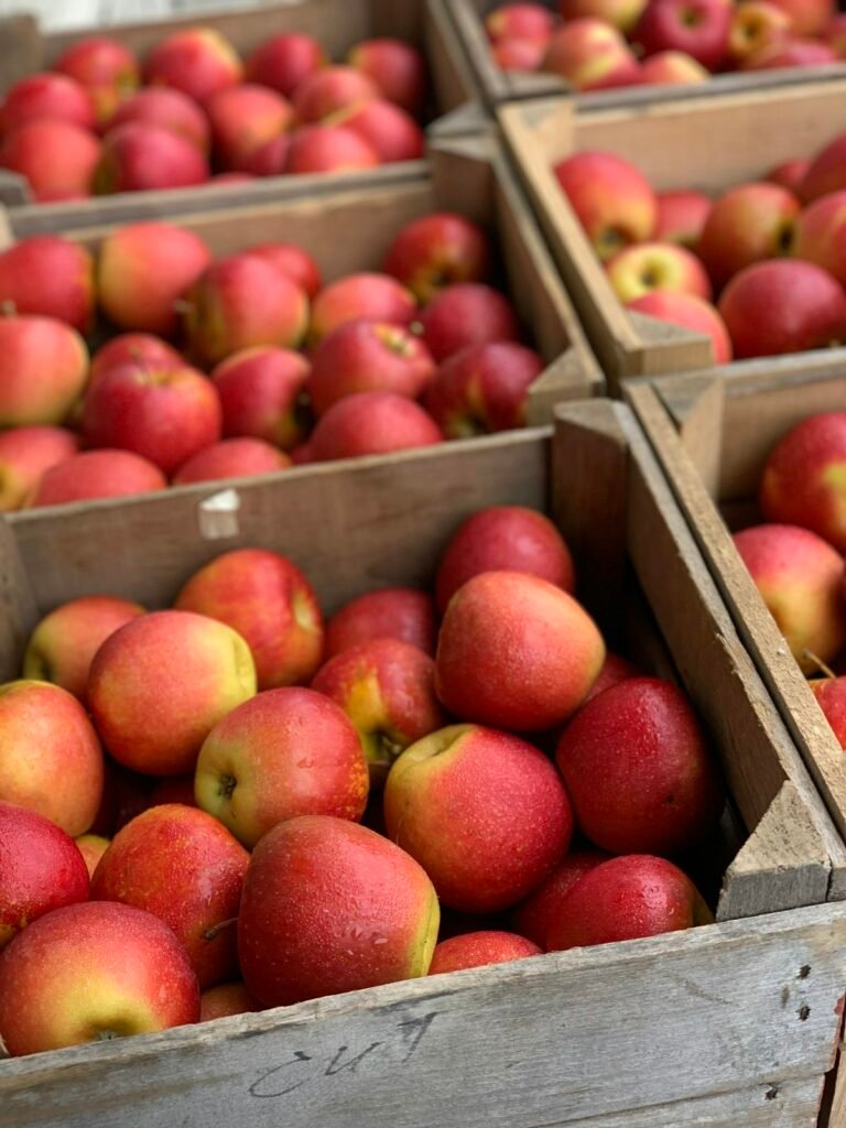 Red apples in a wooden crate