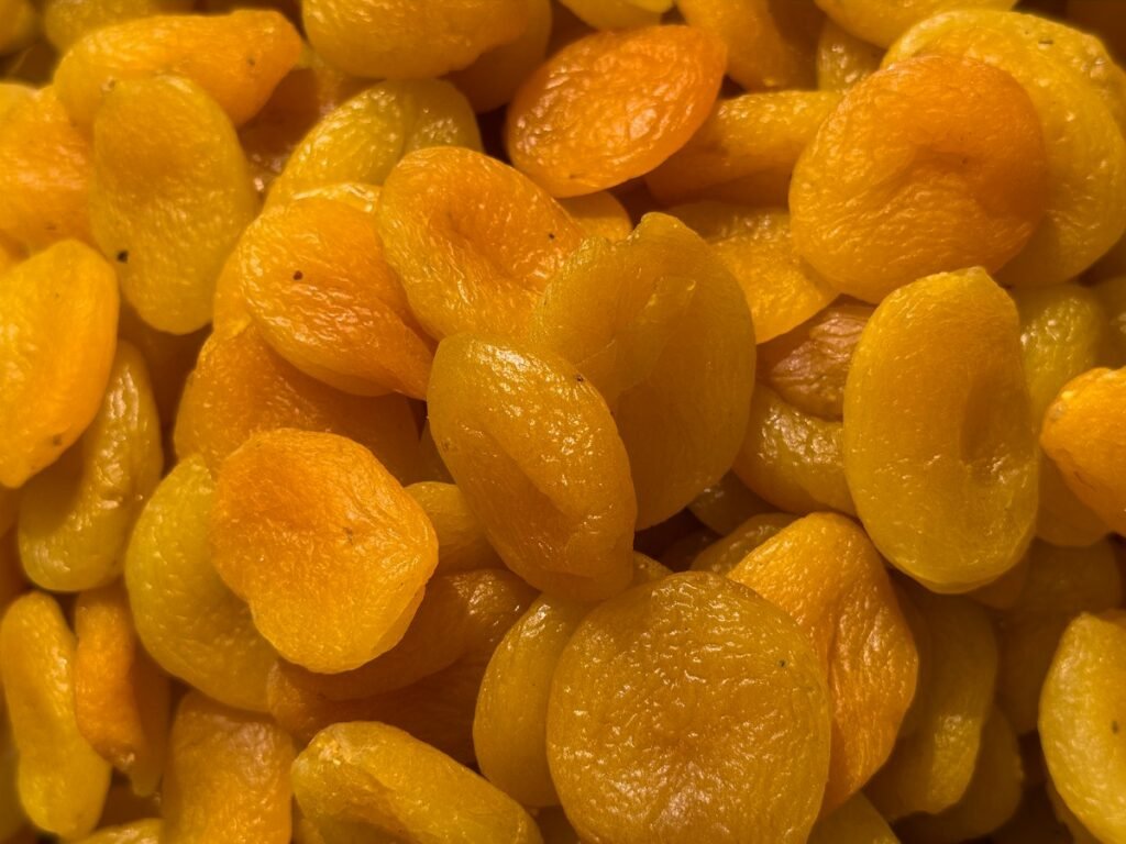 A pile of golden sun-dried apricots